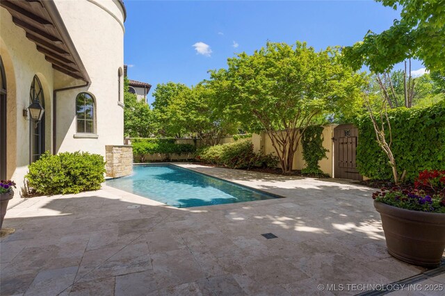 3217 E 61st Pl, Tulsa, OK 74136 - view of swimming pool with a gate, a fenced backyard, a patio, and a fenced in pool