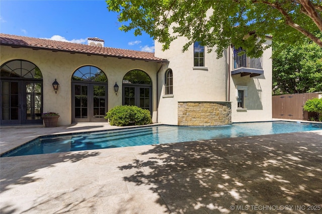 3217 E 61st Pl, Tulsa, OK 74136 - outdoor pool featuring fence, a patio area, and french doors