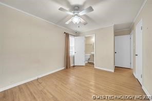 interior space with ornamental molding, baseboards, a ceiling fan, and wood finished floors