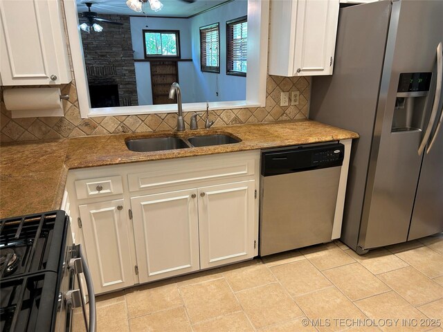 4331 S Norfolk Ave, Tulsa, OK 74105 - kitchen featuring stainless steel appliances, a sink, ceiling fan, and white cabinets