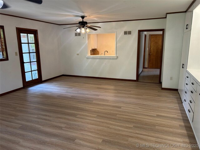 4331 S Norfolk Ave, Tulsa, OK 74105 - unfurnished room featuring a ceiling fan, crown molding, light wood-type flooring, and baseboards