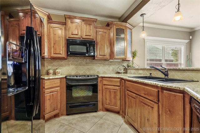 kitchen featuring a sink, hanging light fixtures, black appliances, crown molding, and tasteful backsplash