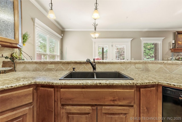 kitchen with brown cabinetry, dishwasher, tasteful backsplash, and a sink