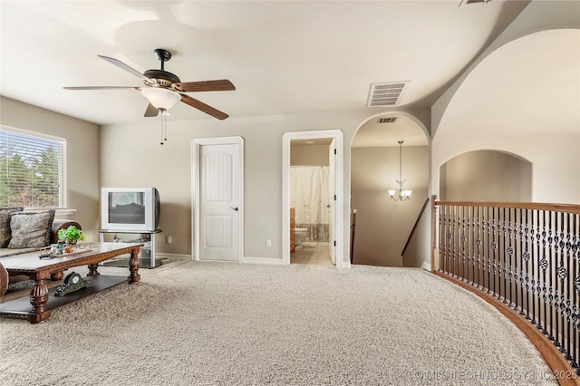 sitting room featuring visible vents, an upstairs landing, ceiling fan with notable chandelier, carpet, and baseboards