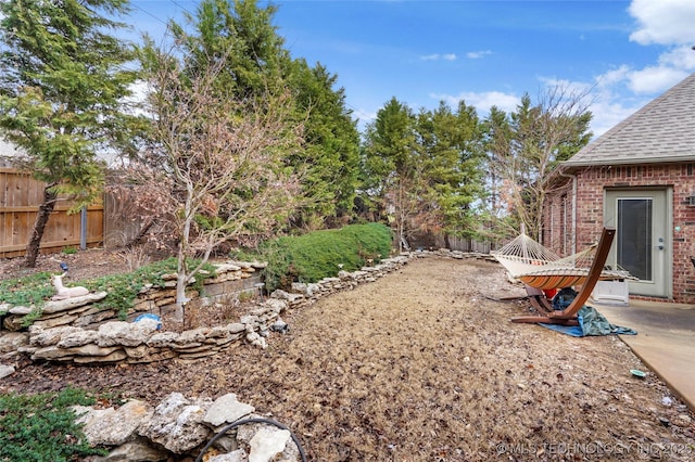 view of yard featuring a fenced backyard and a patio