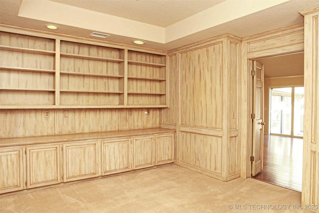 spare room featuring recessed lighting, visible vents, and light carpet