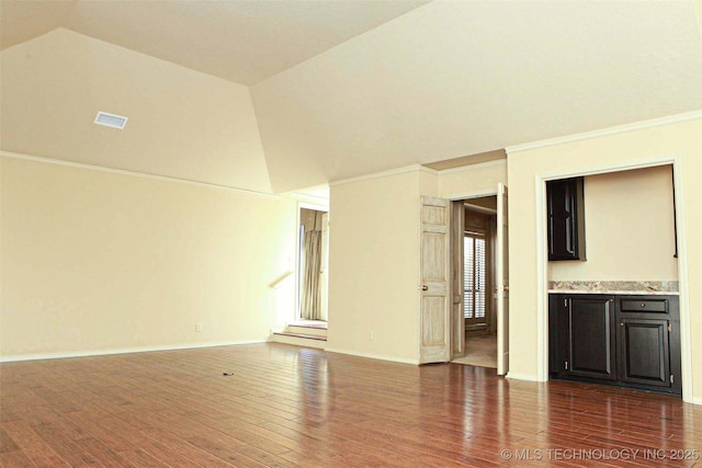 unfurnished living room with dark wood-style floors, high vaulted ceiling, crown molding, and baseboards