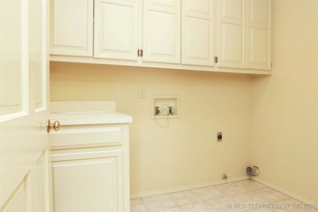 washroom with cabinet space, electric dryer hookup, baseboards, and washer hookup