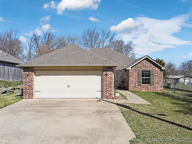 ranch-style house with fence, brick siding, driveway, and a shingled roof