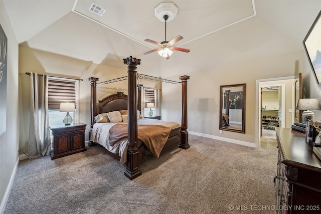 carpeted bedroom with vaulted ceiling, baseboards, visible vents, and ceiling fan