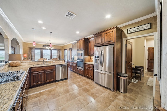 kitchen featuring a sink, stainless steel appliances, visible vents, and ornamental molding