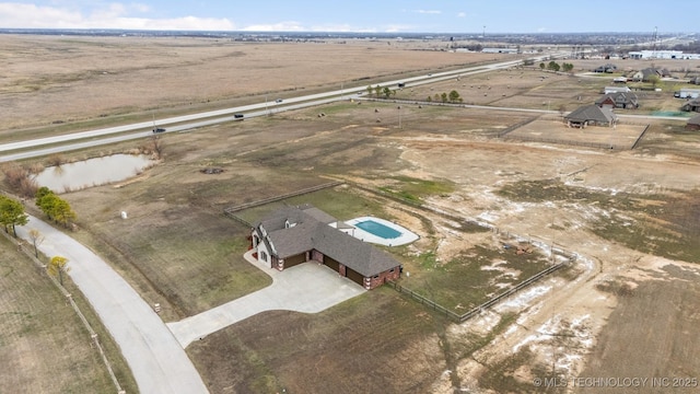 birds eye view of property with a rural view