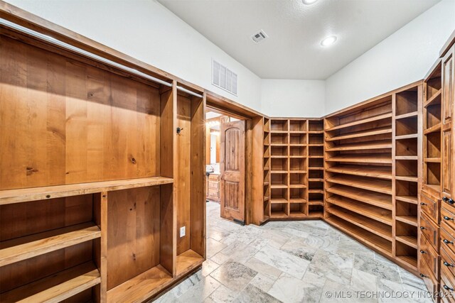 2365 Deer Run, Chouteau, OK 74337 - spacious closet featuring stone tile flooring