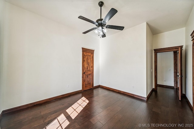 2365 Deer Run, Chouteau, OK 74337 - spare room featuring dark wood-style flooring, baseboards, and ceiling fan