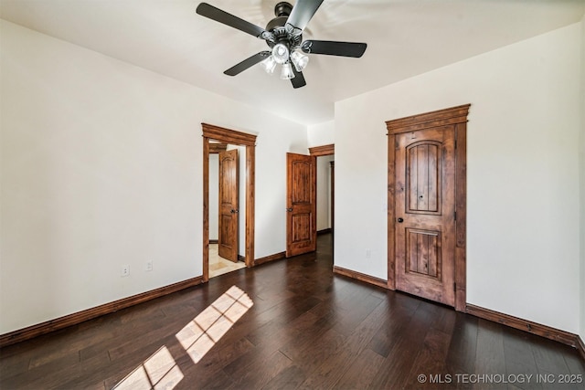 2365 Deer Run, Chouteau, OK 74337 - unfurnished bedroom with dark wood-style floors, baseboards, and ceiling fan