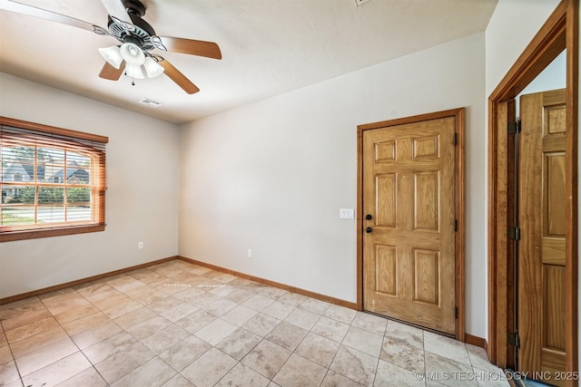 2365 Deer Run, Chouteau, OK 74337 - empty room with baseboards, ceiling fan, and light tile patterned floors