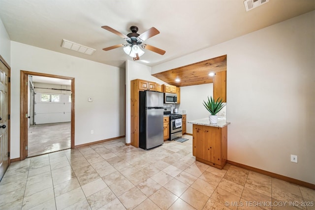 2365 Deer Run, Chouteau, OK 74337 - kitchen featuring stainless steel appliances, a ceiling fan, light stone countertops, and baseboards