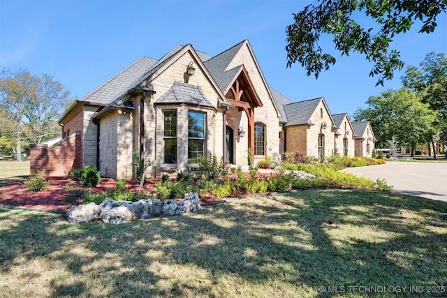 2365 Deer Run, Chouteau, OK 74337 - view of front of house with stone siding and a front lawn