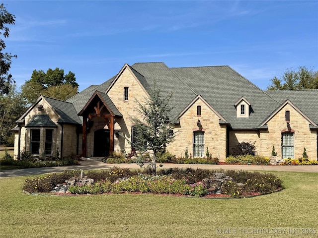 2365 Deer Run, Chouteau, OK 74337 - french country inspired facade featuring stone siding, a front lawn, and a high end roof