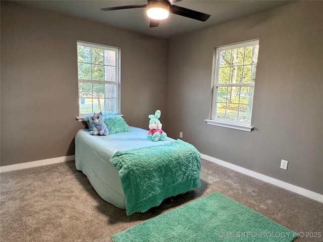 bedroom with baseboards, a ceiling fan, and carpet flooring