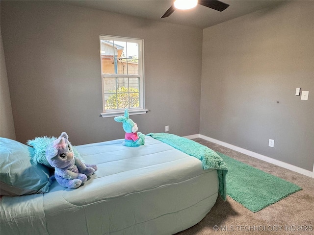 bedroom with baseboards, carpet floors, and ceiling fan