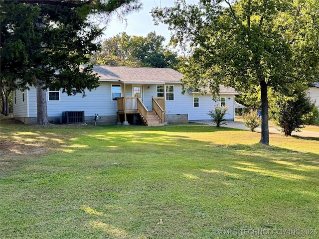 view of front of house featuring crawl space, central AC, a front yard, and a shingled roof