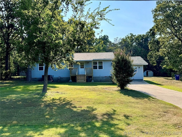 ranch-style home with a front lawn, driveway, and crawl space