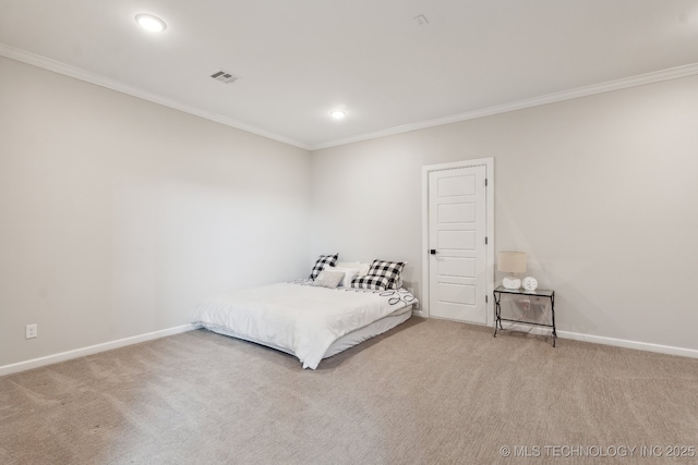 bedroom with visible vents, carpet flooring, and crown molding