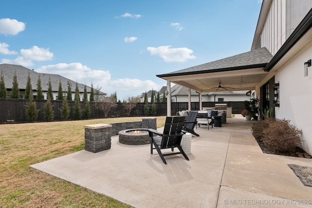 view of patio / terrace with a ceiling fan, a fire pit, and a fenced backyard