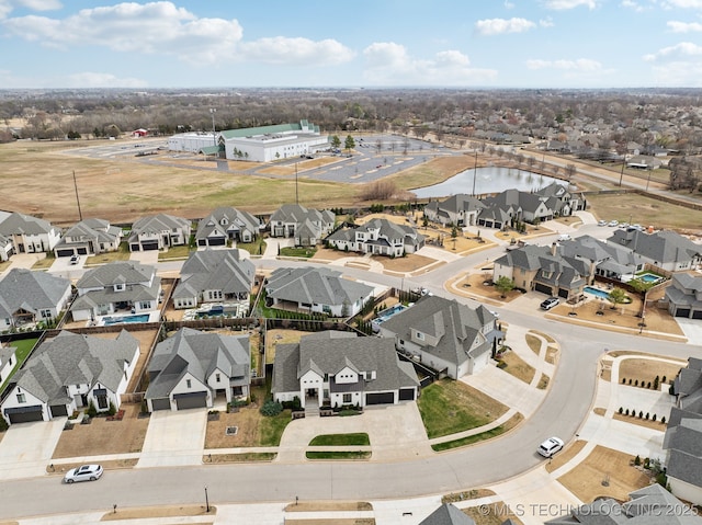 birds eye view of property with a residential view