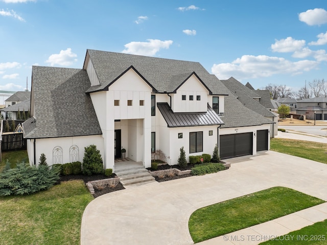 view of front of home featuring a standing seam roof, concrete driveway, roof with shingles, and metal roof