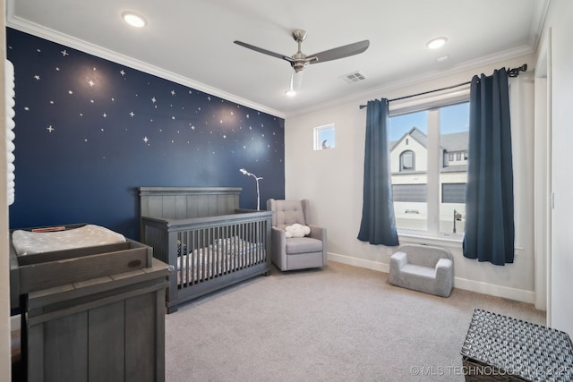 carpeted bedroom featuring visible vents, crown molding, wallpapered walls, and an accent wall