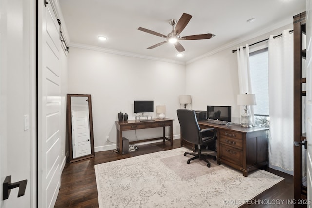 office with a barn door, plenty of natural light, dark wood-style floors, and crown molding