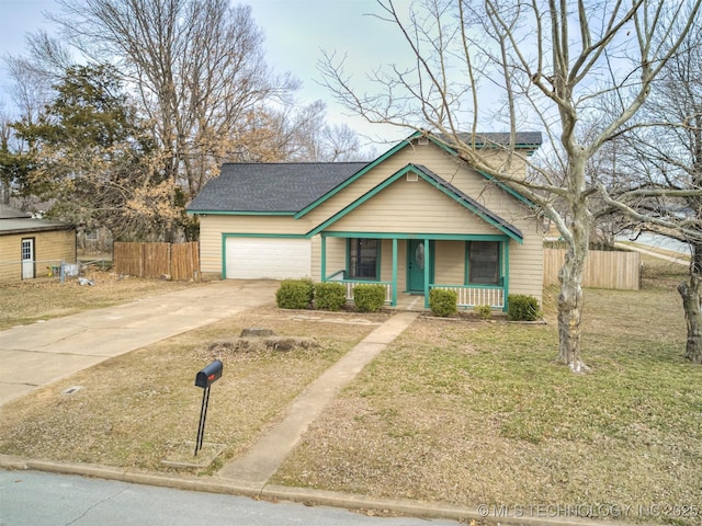 bungalow-style house with a front lawn, driveway, a porch, fence, and a garage