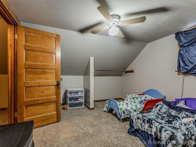 carpeted bedroom with baseboards, lofted ceiling, a textured ceiling, and ceiling fan