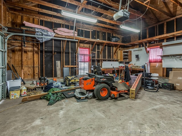 garage featuring a workshop area and a garage door opener