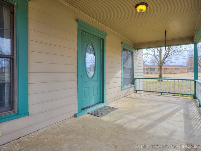 doorway to property with a porch