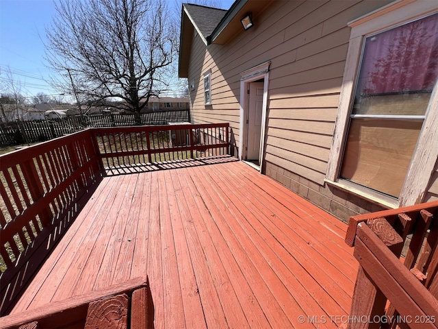 wooden deck featuring fence