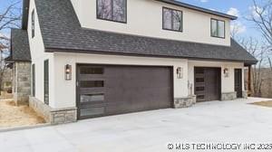 exterior space with concrete driveway