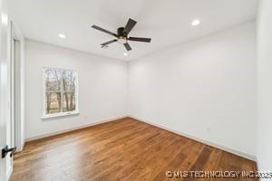 unfurnished room featuring recessed lighting, wood finished floors, and ceiling fan