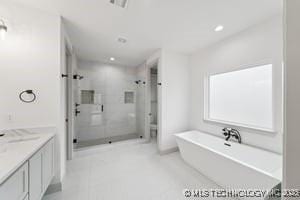 full bath with recessed lighting, a soaking tub, a stall shower, and vanity