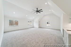 bonus room featuring recessed lighting, lofted ceiling, light carpet, and a ceiling fan