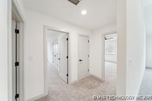 corridor with recessed lighting and baseboards