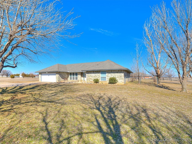 single story home featuring a front lawn and a garage