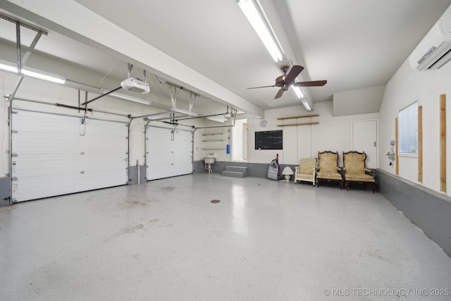 garage featuring ceiling fan, a garage door opener, and a wall mounted AC
