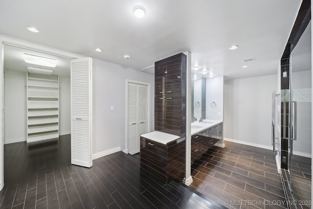full bathroom with visible vents, baseboards, recessed lighting, wood finished floors, and a closet