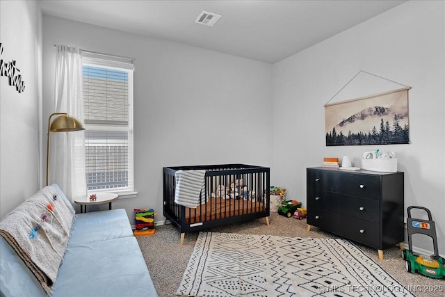 bedroom with visible vents, multiple windows, and light carpet