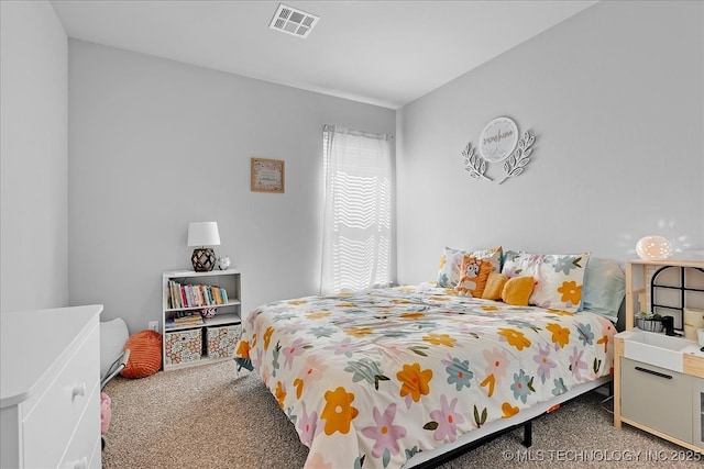 bedroom with visible vents and carpet floors