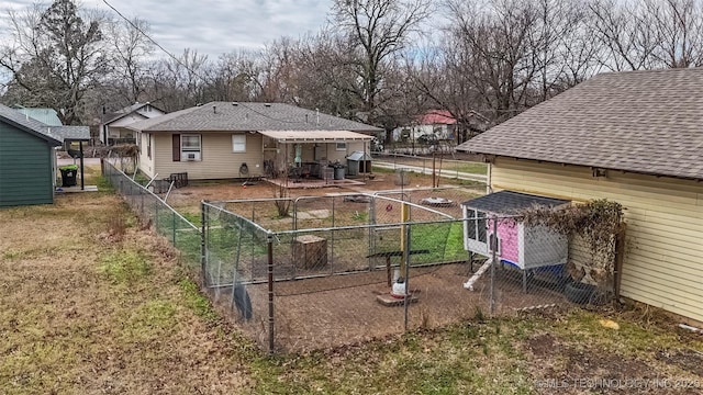 view of yard with an outbuilding and fence