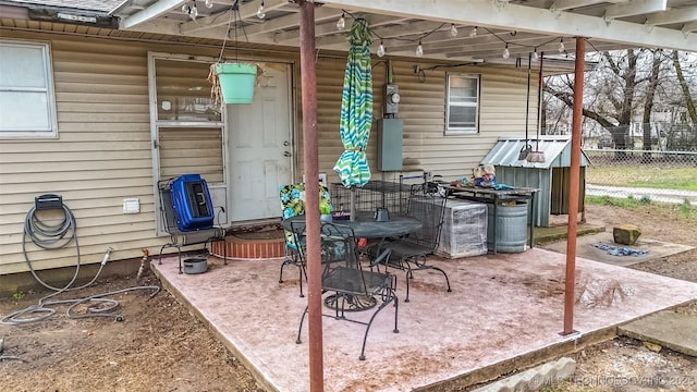 view of patio featuring fence